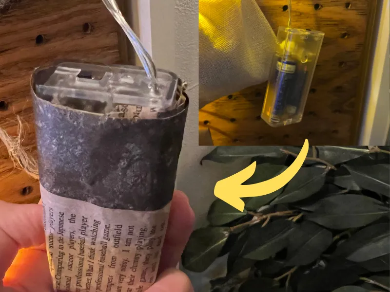 電飾の電池部分に包装紙を巻きつける